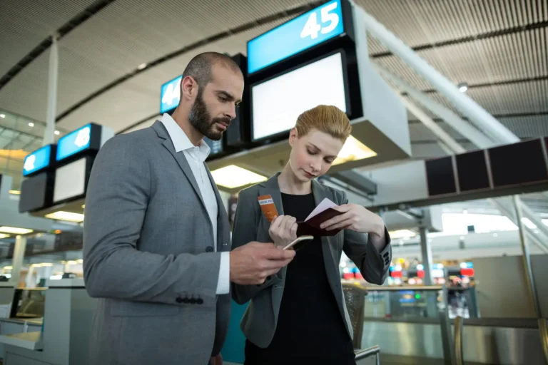 business-people-holding-boarding-pass-using-mobile-phone_107420-95773