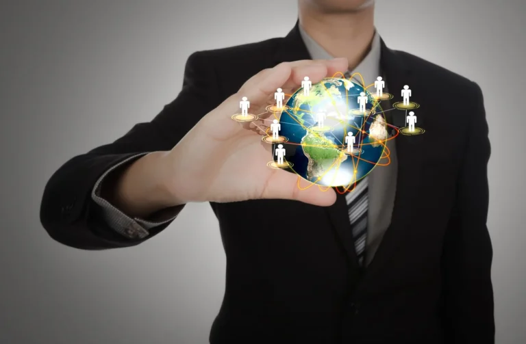 businessman-holding-planet-earth-with-people-symbols_1232-896