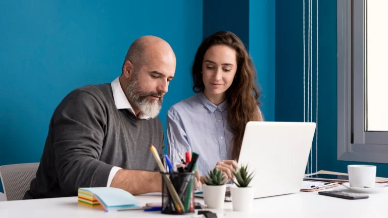 colleagues-working-together-office_23-2148513791