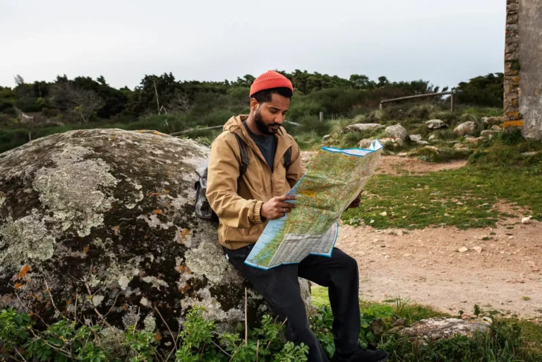 full-shot-man-holding-map_23-2150343022