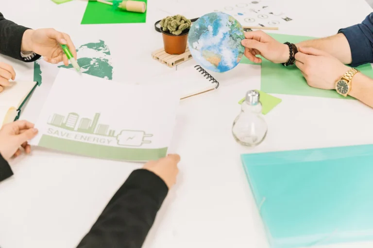 group-businesspeople-working-energy-saving-desk_23-2147826625
