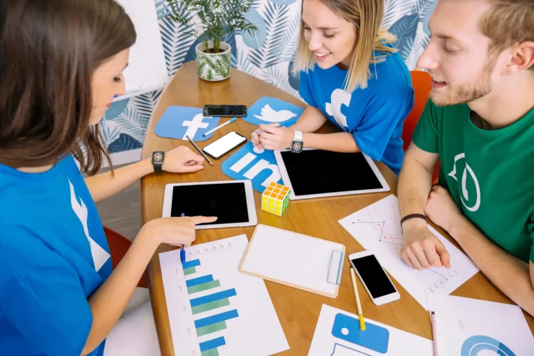 group-people-looking-digital-tablet-with-social-media-icons-workplace_23-2147847544