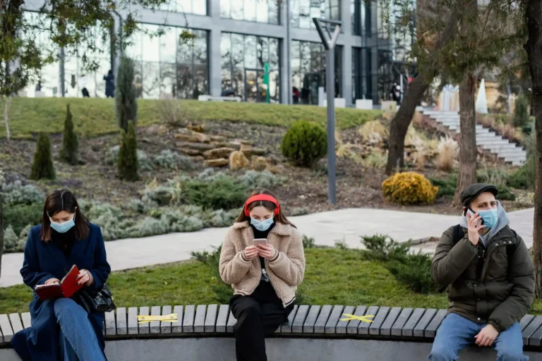 people-sitting-distance-wearing-mask_23-2148863872