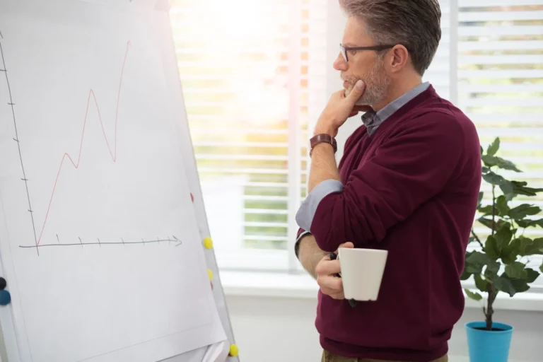 thoughtful-worker-looking-white-board_329181-10326