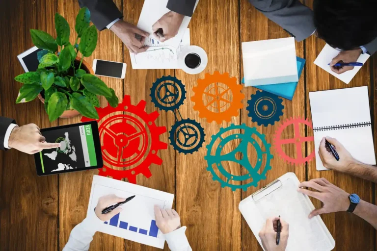 top-view-businesspeople-working-with-icons-painted-table_1134-100